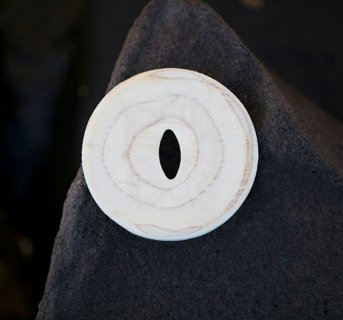 Soap dish round with a hole in the center in white with pale brown rings